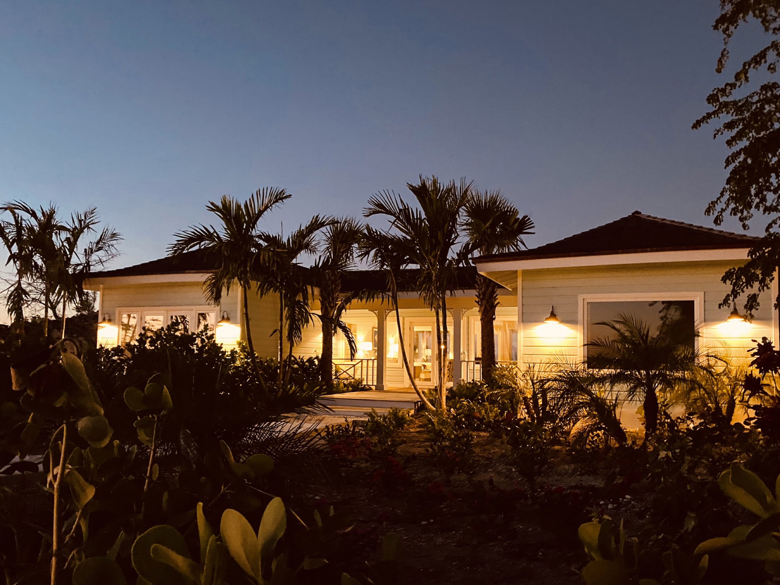 amani house bahamas entrance at night lights